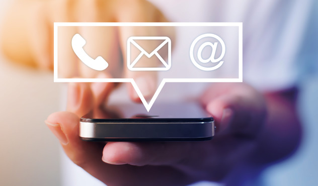 Close-up image of male hands using smartphone with icon telephone email mobile phone and address. Contact us connection and e-mail marketing concept